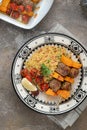 Moroccan couscous with lamb kebab on skewers on traditional plate Royalty Free Stock Photo