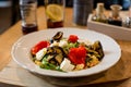 Moroccan couscous with vegetable on white plate, gorgeous looking gourmet food