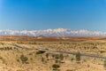 Moroccan desert road in Ouarzazate province. Road curve. Royalty Free Stock Photo