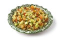 Moroccan dish with mixed vegetable salad and herbs