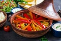 Moroccan food. Traditional tajine dishes, couscous and fresh salad