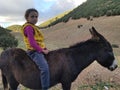 Moroccan Girl riding donkey Northern Morocco