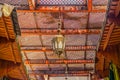 Moroccan lantern and cedar wood carved ceiling Royalty Free Stock Photo