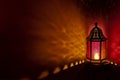 Moroccan lantern with colored glass at night time