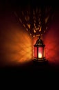 Moroccan lantern with colored glass at night time