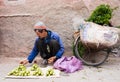 Moroccan Man Arranging his Vegetables for Sale