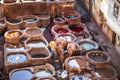 A Moroccan man working with animal hides in the leather tannery. Fez, Morocco Royalty Free Stock Photo