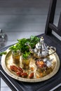 Moroccan mn tea in traditional glasses with mint, dates and sugar Royalty Free Stock Photo