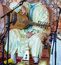 A Moroccan musician wearing a Moroccan djellaba