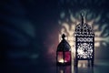 Moroccan ornamental lanterns on the table glowing at night. Greeting card, invitation for Muslim holy month Ramadan