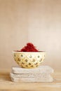 Moroccan saffron treads in bowl, on wood