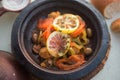 Moroccan sardine balls with vegetables and lemon and olives