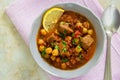 Moroccan soup harira with meat, chickpeas, lentil, tomato and sp