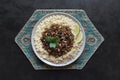 Moroccan spiced mince with couscous on a black. Royalty Free Stock Photo