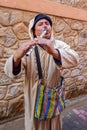 Moroccan Street Flutist wearing a traditional jellaba