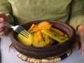 Moroccan Tagine and human hand