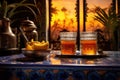 moroccan tea glasses with steam rising against a backdrop of moroccan tiles