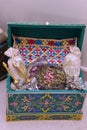 Moroccan Tyafer, traditional gift containers for the wedding ceremony, decorated with ornate golden embroidery.Moroccan henna .