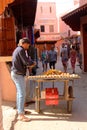 Moroccan vendor selling food in a street of medina - historical centre Royalty Free Stock Photo