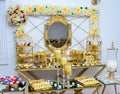 Moroccan wedding buffet. A glass table full of Moroccan sweets. Moroccan biscuits served at the wedding. Golden buffet