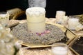Moroccan wedding. A candle on a table filled with natural herbs that the bride uses