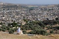 Moroccan woman in golden djellaba and white hijab