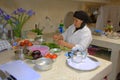 Woman preparing food in her kitchen