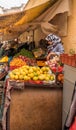 Moroccan woman selling fruits and vegetables.