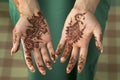 Moroccan woman with henna painted hands