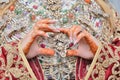 Moroccan woman with traditional henna painted hands.