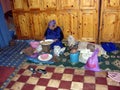 Moroccan woman working at argan nuts