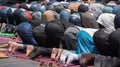 Moroccans praying in ramadan on carpet, posture mujut, Salat