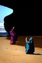 Morocco, beach Legzira - September 17: Local woman posing in bright clothes on the beach.