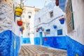 Morocco is the blue city of Chefchaouen, endless streets painted in blue color. Lots of flowers and Souvenirs in the beautiful Royalty Free Stock Photo