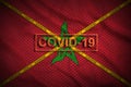Morocco flag and Covid-19 stamp with orange quarantine border tape cross. Coronavirus or 2019-nCov virus concept