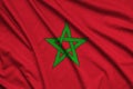 Morocco flag is depicted on a sports cloth fabric with many folds. Sport team banner