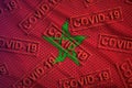 Morocco flag and many red Covid-19 stamps. Coronavirus or 2019-nCov virus concept