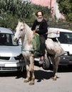 Morocco, the market square of the city of Fez. March 12 2019. Horseman riding a bazaar