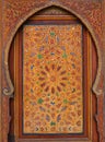 Morocco, Marrakesh. Detail of a medieval painted wooden door panel symmetrical Islamic - Arabesque style Royalty Free Stock Photo