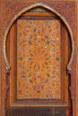 Morocco, Marrakesh. Detail of a medieval painted wooden door panel symmetrical Islamic - Arabesque style Royalty Free Stock Photo