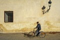 Morocco. Marrakesh. An old man on a bicycle in a street in the medina