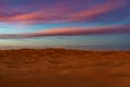 Morocco. Merzouga. Sand dunes of Sahara desert under a blue sky at dusk