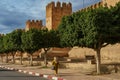 Morocco. Taroudant. A woman walking front of the city walls