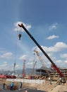 crane operator unloads steel at the project site