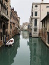 Morred boat in the narrow canal in Venice Royalty Free Stock Photo