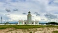 Morrillos Light surrounded by a field under a cloudy sky in Puerto Rico