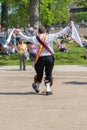 Morris dancer receives applause and adulation from crowd in English park