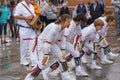 Morris Dancers Dressed in White and Wearing Knee Bells and Coloured Ribbons as They Dance Near the Seafront at Whitby Folk Week.