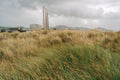 Sand dunes, native plants, and power plants on Morro Bay, California. Three 450-feet-high power plant visible from 10 miles away Royalty Free Stock Photo