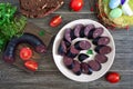 Morsilla - blood sausage. Pieces of Spanish black pudding on a plate. Easter menu Royalty Free Stock Photo